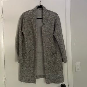 Comfy light grey sweater jacket. Looks way better on.